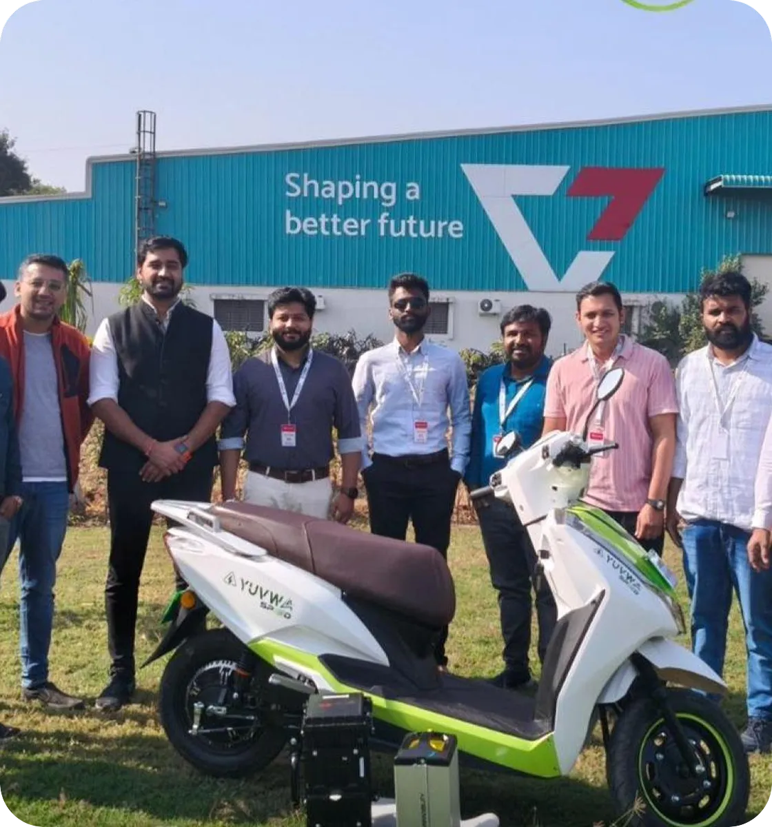 A Comptech team handing over electric scooters to a corporate customer