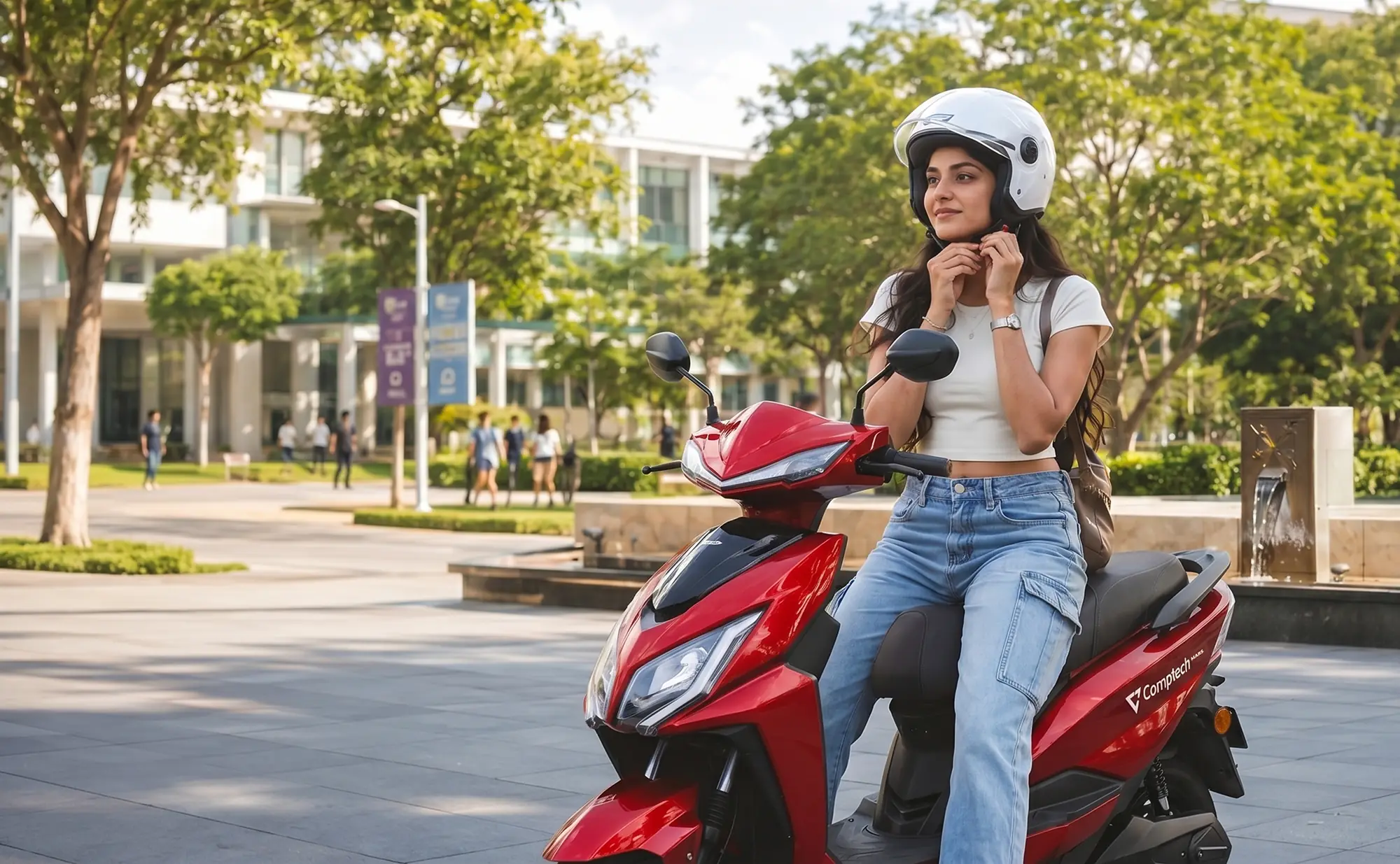 A young rider fastening her helmet on a red Comptech Mars in a campus plaza